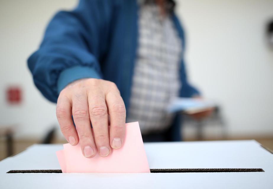 Man casting a ballot.
