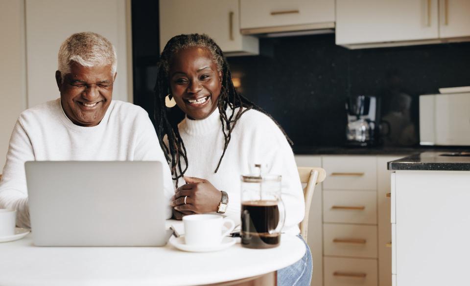 Smiling couple in front of computer