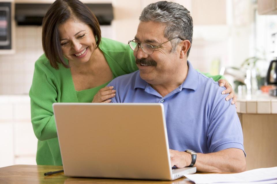 Couple in front of a computer