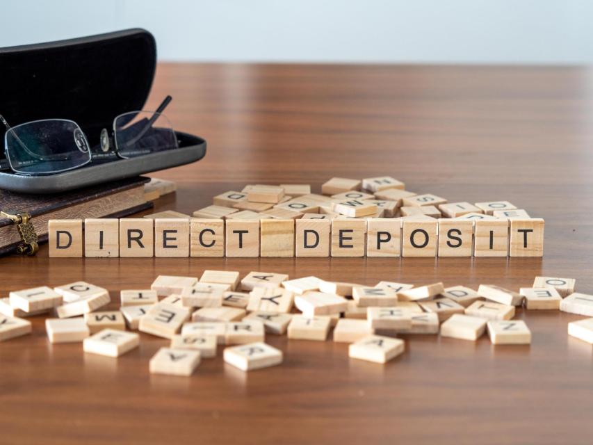Wooden blocks with words Direct deposit  spelled out.