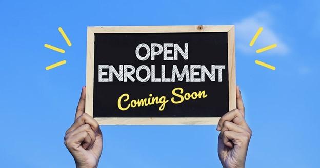 Chalkboard sign that reads "Open Enrollment Coming Soon".