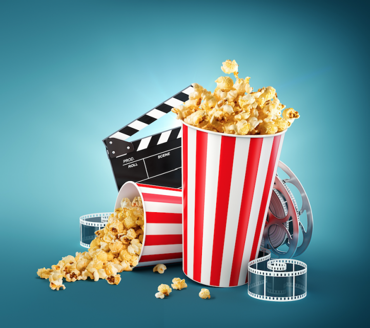 Movie theater popcorn and film reel