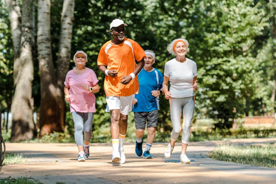 Group of senior citizens running outdoors