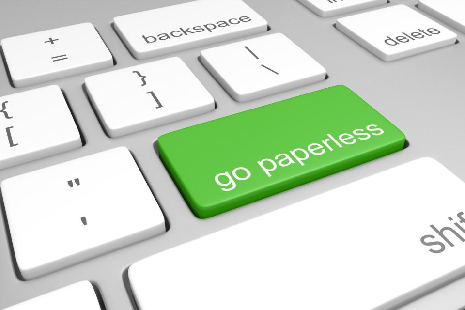 Go paperless key on a computer keyboard.