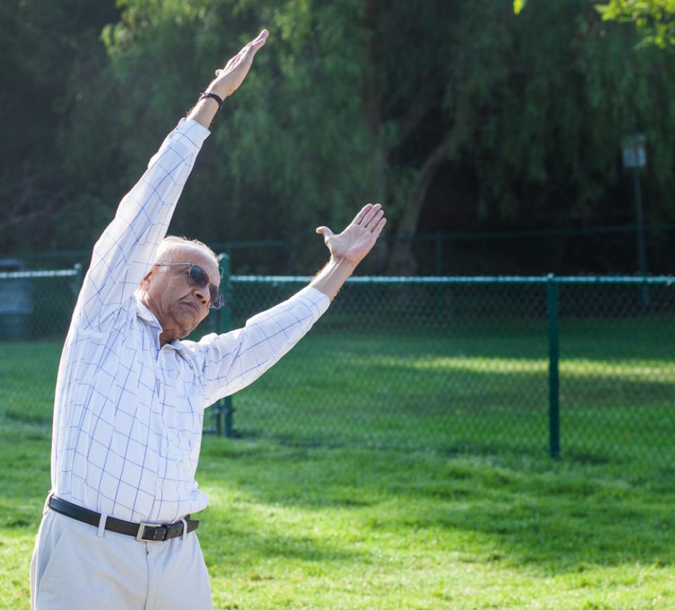 man stretching outside