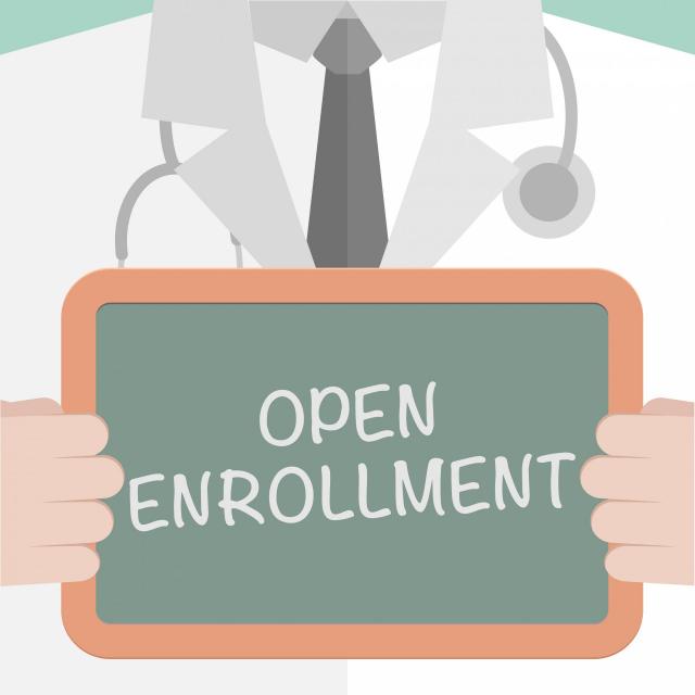 Image of doctor holding open enrollment sign