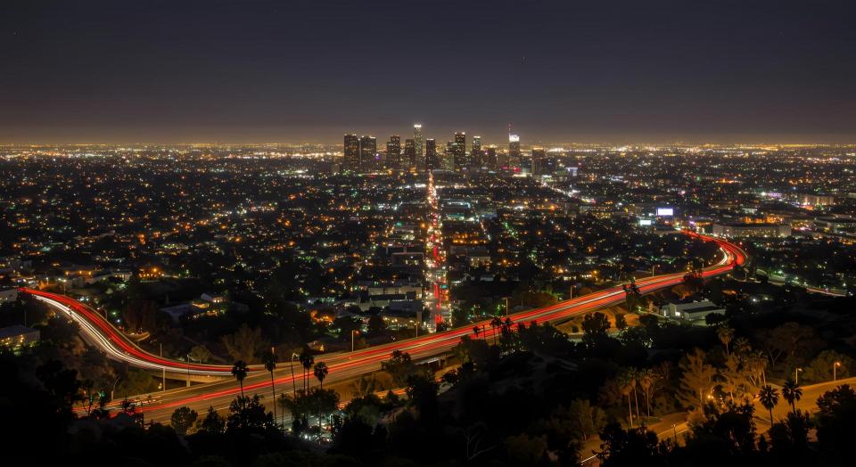Vibrant Los Angeles Nightscape: City Lights, Urban Skyline, and Iconic Landmarks Under Starry Sky