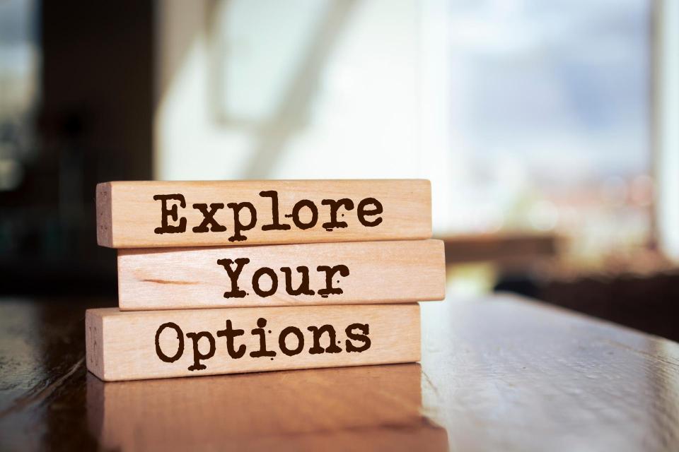 Wooden blocks with words 'Explore Your Options'