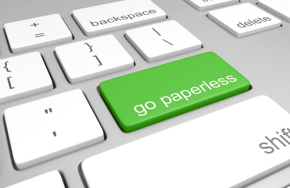 Go paperless key on a computer keyboard.