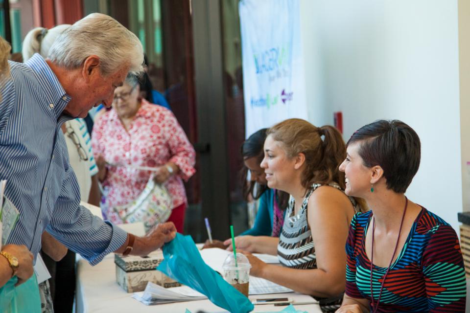 man talking to a woman at a table
