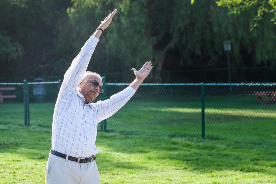 man stretching outside