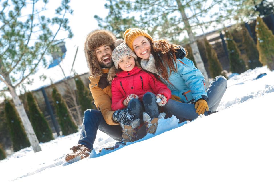 Family enjoying snowplay
